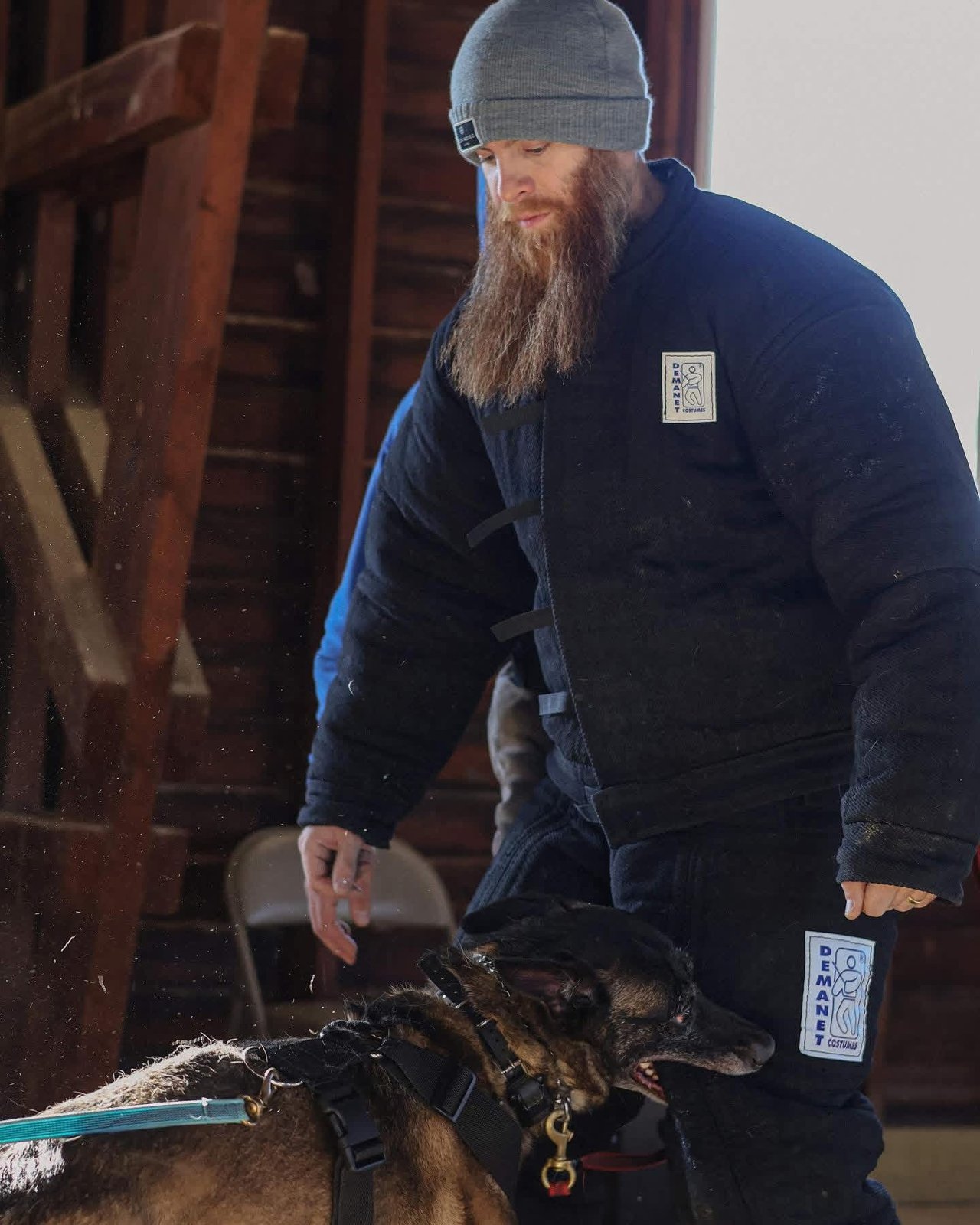 Brian in a bite suit working a dog